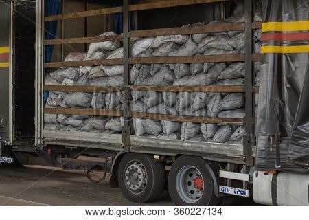 Krakovets, Ukraine - August, 2019: An Open Truck Trailer Carrying A Load Of Charcoal During Customs 