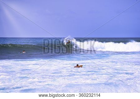 Hossegor, France - February Circa , 2019. An Unidentified Surfer Man Catching Riding On An Ocean Wav