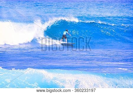 Hossegor, France - February Circa , 2019. An Unidentified Surfer Man Catching Riding On An Ocean Wav