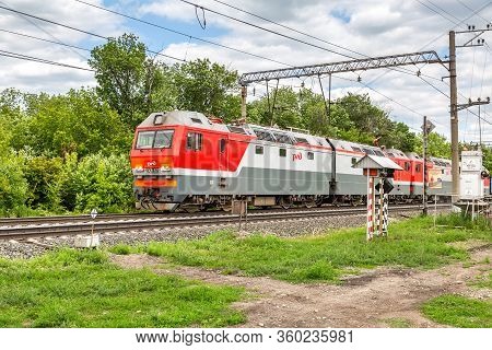 Penza, Russia - July 6, 2019: Russian Electric Locomotive With Freight  Train. Cargo Train Logistic 