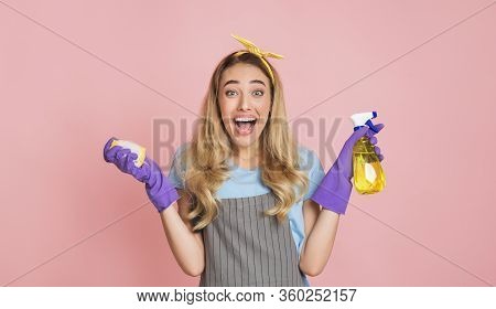 Housework With Joy. Housewife With Open Mouth In Apron With Rubber Gloves