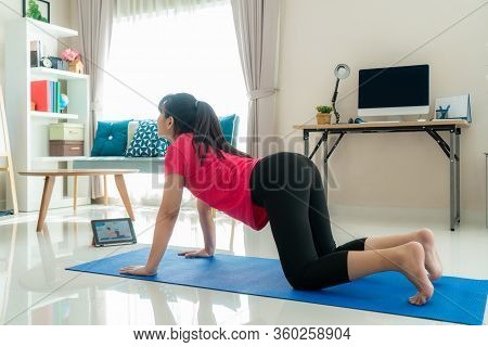 Asian Woman Making Yoga Exercise For Step Away From Their Computers To Take Mid-day Exercise Breaks 