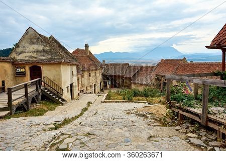 Street Of The Ancient Fortress Town. Medieval Walled City Rasnov On Hill, Romania. Autumn Landscape