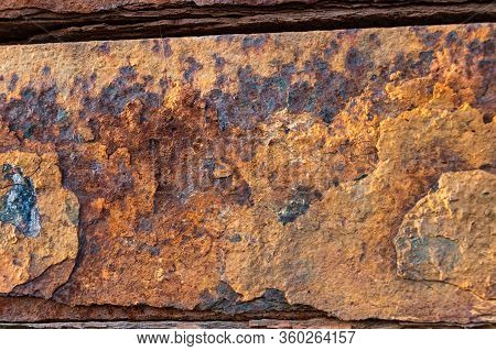 Heavily Rusted And Corroded Metal Sheet In An Industrial Area, Suitable As A Background, Pattern And