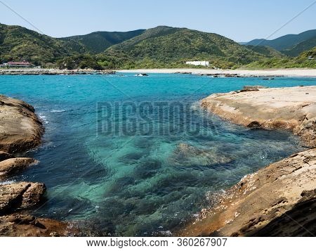 Sandstone Rock Formations And Clear Blue Waters At Tatsukushi Coast - A Natural Scenic Landmark Near