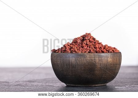 Annatto Organic Seeds In The Wooden Bowl - Bixa Orellana