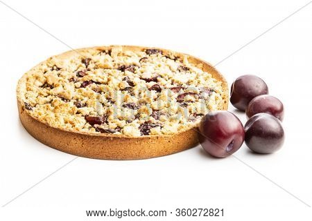 Sweet plum pie and plums isolated on white background.