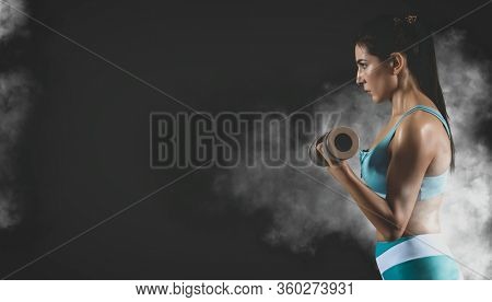 Woman working out with dumbbell. Sports banner. Horizontal copy space background. Matte effect 