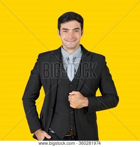 A Young Businessman In A Gray Shirt And A Black Suit, Put His Hand In The Pocket Pant And Smiling Hu