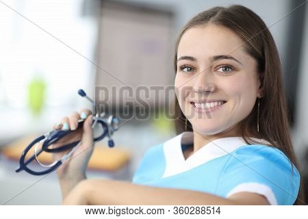 Close-up Of Cheerful Therapist Looking At Camera With Happiness And Smile. Beautiful Practitioner Ho