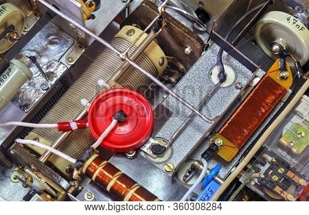 Inside View Of High Frequency Power Amplifier With Capacitors, Coils And Other Components