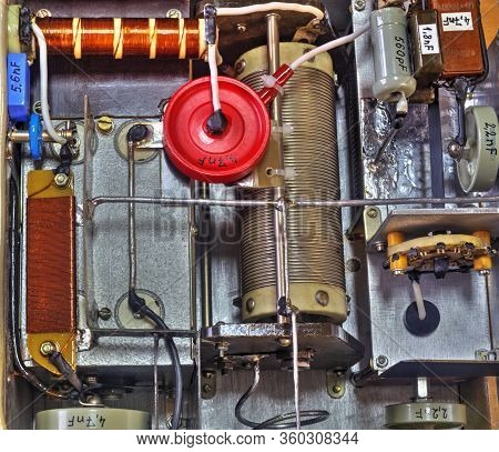 Inside View Of High Frequency Power Amplifier With Capacitors, Coils And Other Components