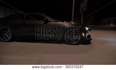Tomsk, Russia - March 30, 2020: Chevrolet Camaro Zl1 The Exorcist Rides On The Road At Night Side Vi