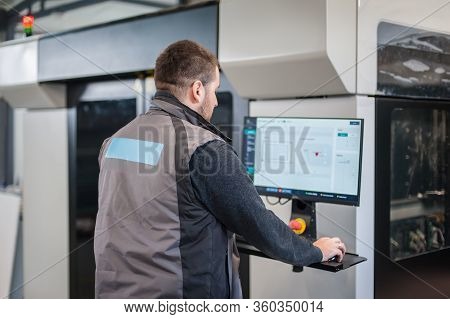Worker Printmaker Technician Works On Large Modern 3D Printer Machine