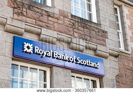 Fort William, Scotland - August 3, 2019: Logo Of The Royal Bank Of Scotland On A Blue Signboard At V