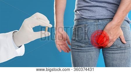 Doctor Holding Suppository For Hemorrhoid Treatment And Man Suffering From Pain On Blue Background, 