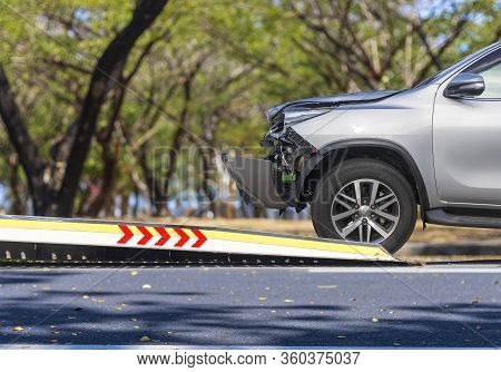 Accident Car Slide On  Truck For Move. Gray Car Have Damage By Accident On Road Take With Slide Truc