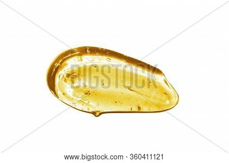 Vitamin C Serum, Cosmetic Gel Texture. Transparent Yellow Gel With Bubbles In A Beautiful Smear