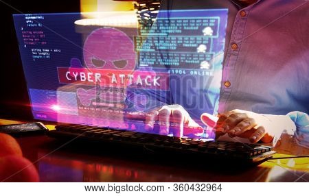 Hacker Typing On The Keyboard And Breaks Computer Security On Virtual Hologram Screen On Desk. Cyber