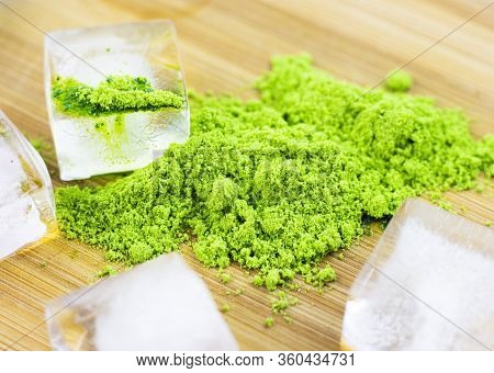 Different Colors Of Japanese Matcha Tea: Green, Red And Blue With Ice Pieces On A Wooden Stand. Powd