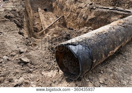 repair and replacement main pipeline of heating systems, district heating pipes network, water supply or Sewerage in city, removing old pipes and replacing them with new ones in a hole in the ground