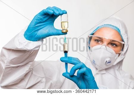 Doctor, Nurse Or Scientist Hand In Blue Nitrile Gloves Holding Flu, Measles, Coronavirus Covid-19 Va