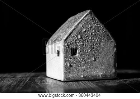 A Handmade Clay House With Water Drops