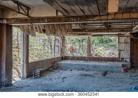 Hwanggan, South Korea; April 8, 2020: Interior Of Abandoned Restaurant Building Left To Decay And Ru