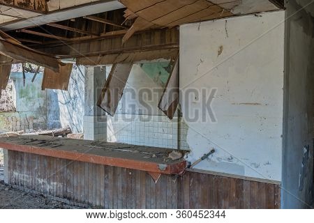 Hwanggan, South Korea; April 8, 2020: Bar Area Inside Abandoned Restaurant Building Left To Decay An