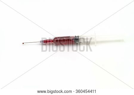 Syringe With Blood Isolated On White Background