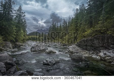 The Beauty Of Wally Creek Pullout. Forest, Wild River, Rocks And Trees On Vancouver Island In Canada
