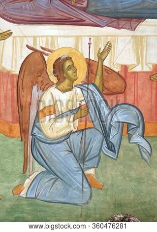 TREBINJE, BOSNIA AND HERZEGOVINA - MAY 01, 2019: Angel, fresco at the external wall of the 15th-century monastery Assumption of the Virgin Mary in Tvrdos near Trebinje, Bosnia and Herzegovina