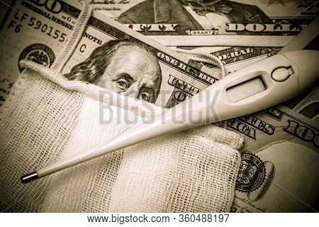 A Hundred-dollar Bill With A Medical Mask .the Concept Of Coronavrius Epidemic