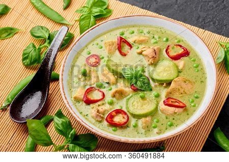 Thai Green Curry With Chicken Or Gaeng Kaew Wan Gai In White Bowl At Black Slate Background. Thai Gr