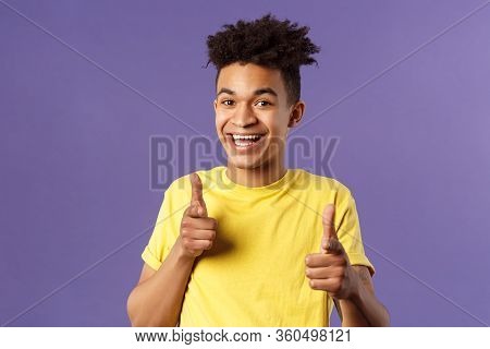 Believe In You. Portrait Of Cheerful Young Optimistic Guy Encuraging To Keep Going, Pointing Fingers