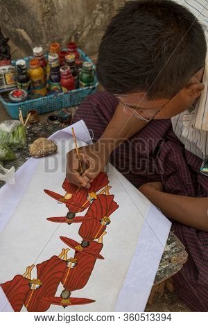 Bagan, Myanmar - March, 1, 2016 : Burmese Artist Man Draw A Beautiful Art Painting At The Entrance O