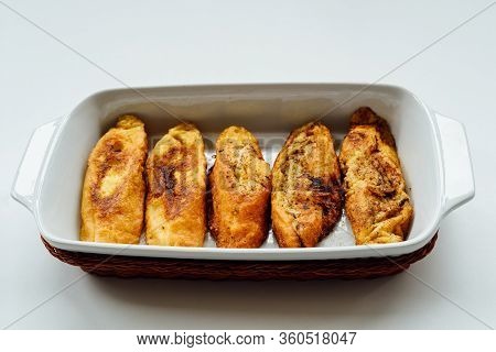 Torrijas, Typical Spanish Sweet Fried Toasts Of Sliced Bread Soaked In Eggs And Milk On Tray Isolate