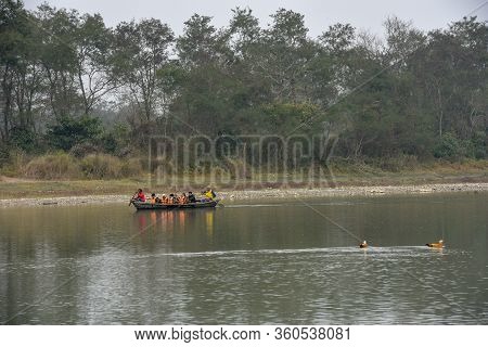 Tourists On A Canoe Safari At Chitwan National Park On Nepal