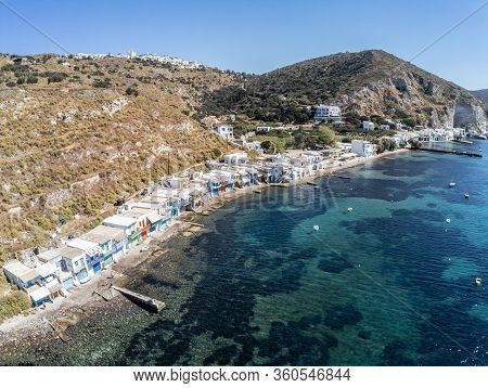 Aerial View Of Houses And Cliffs In Klima Beach With Krypti Village In Background, Milos, Greece