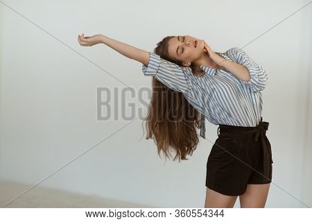 Young Beautiful Girl Is Dancing In The Style Of Contemp.