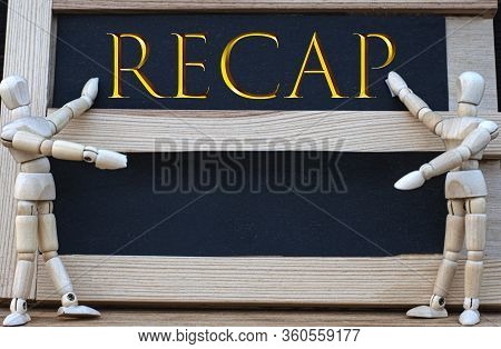 Recap Word Written On A Black Board. Nearby Are Two Wooden Men. Business Concept.