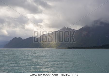 Sunlight Over Glacier Mountain Near Aialik Glacier On Aialik Bay In Kenai Fjords National Park In Se