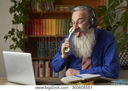 Concept Of Distance Learning For Young Children. Waggish Teacher Tutor Teaches Child To Read And Cou