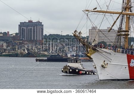 New Bedford, Massachusetts, Usa - August 13, 2018: Tug Jaguar Escorting U.s. Coast Guard Training Sh