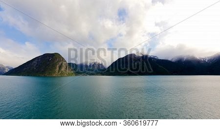 Fjord Mountains In Skjolden Norway With Calm Seas
