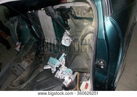 Krakovets, Ukraine - December, 2013: Smuggled Cigarettes Hidden In The Body And Passenger Compartmen