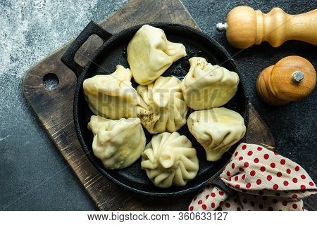 Traditional Georgian Khinkali Dish On Stone Background