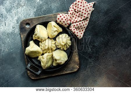 Traditional Georgian Khinkali Dish On Stone Background