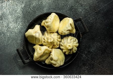 Traditional Georgian Khinkali Dish On Stone Background