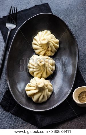 Traditional Georgian Khinkali Dish On Stone Background